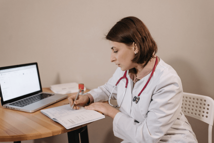 Practice owner in a medical or dental office signing documents