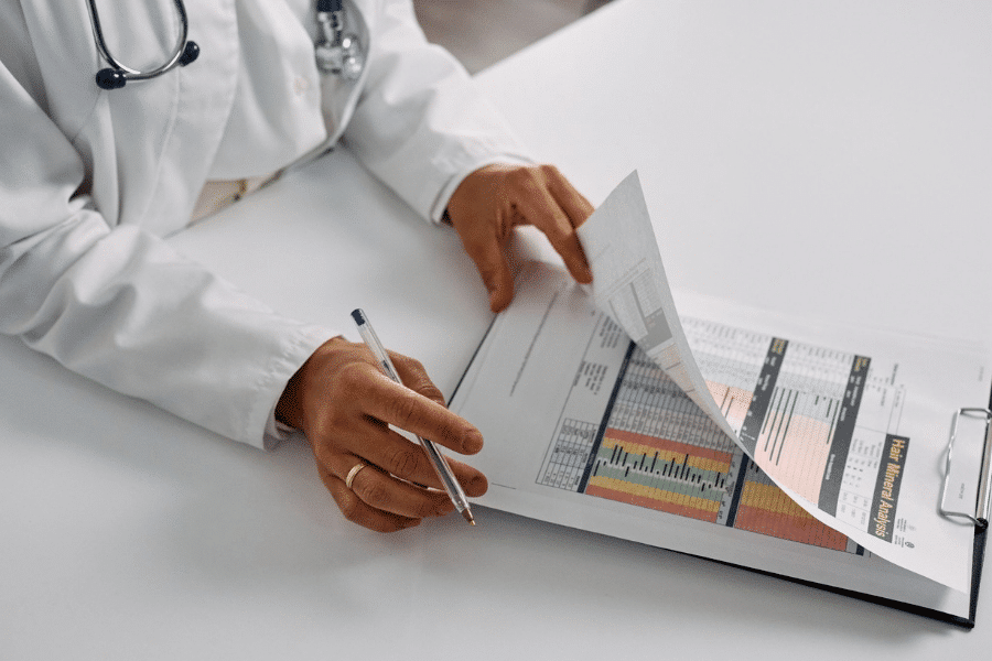Physician reviewing entity documents as part of tax planning for physicians