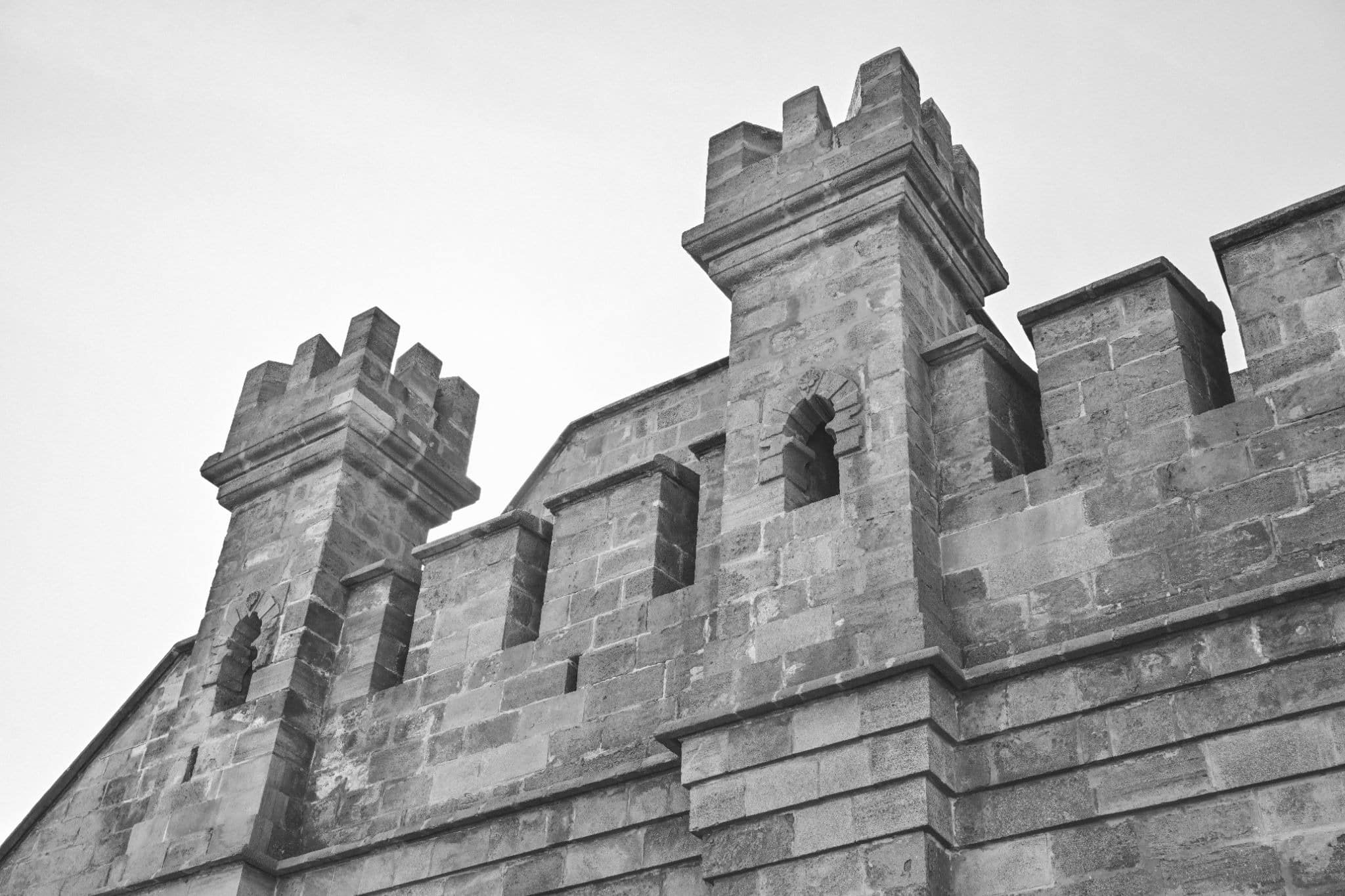 Stone fortress with battlements, symbolizing a secure asset protection structure for real estate investors