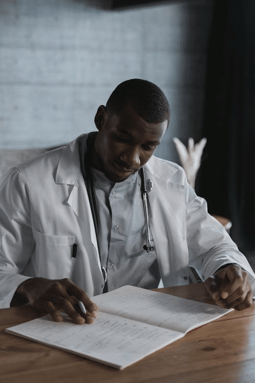 A confident physician reviewing documents