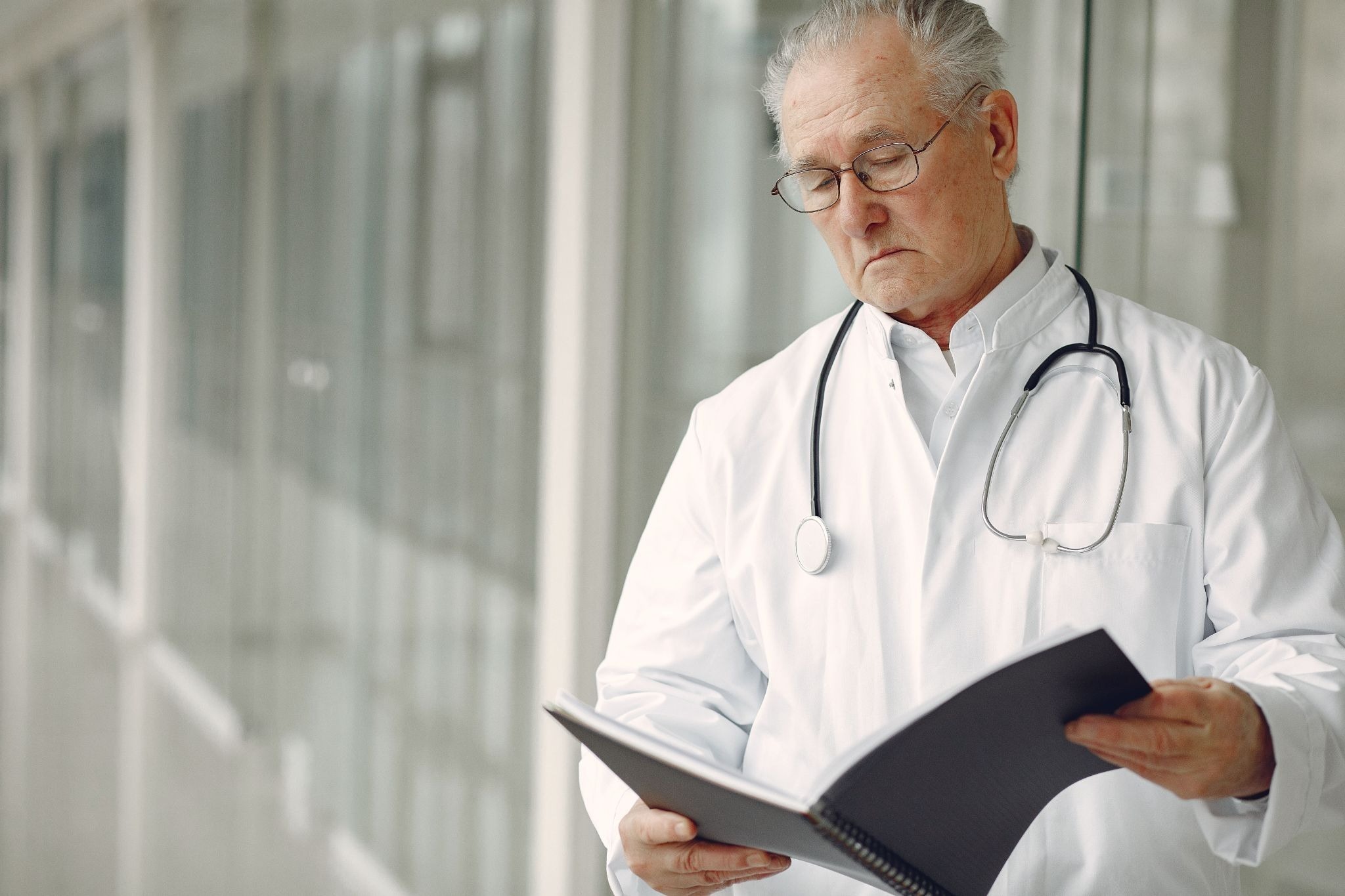 A doctor looking a documents