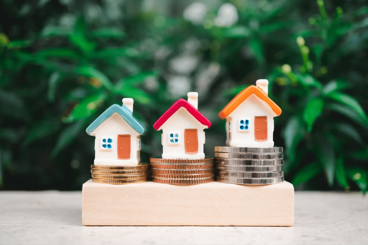 Visual image of the August Law; little houses sitting on top of coins.