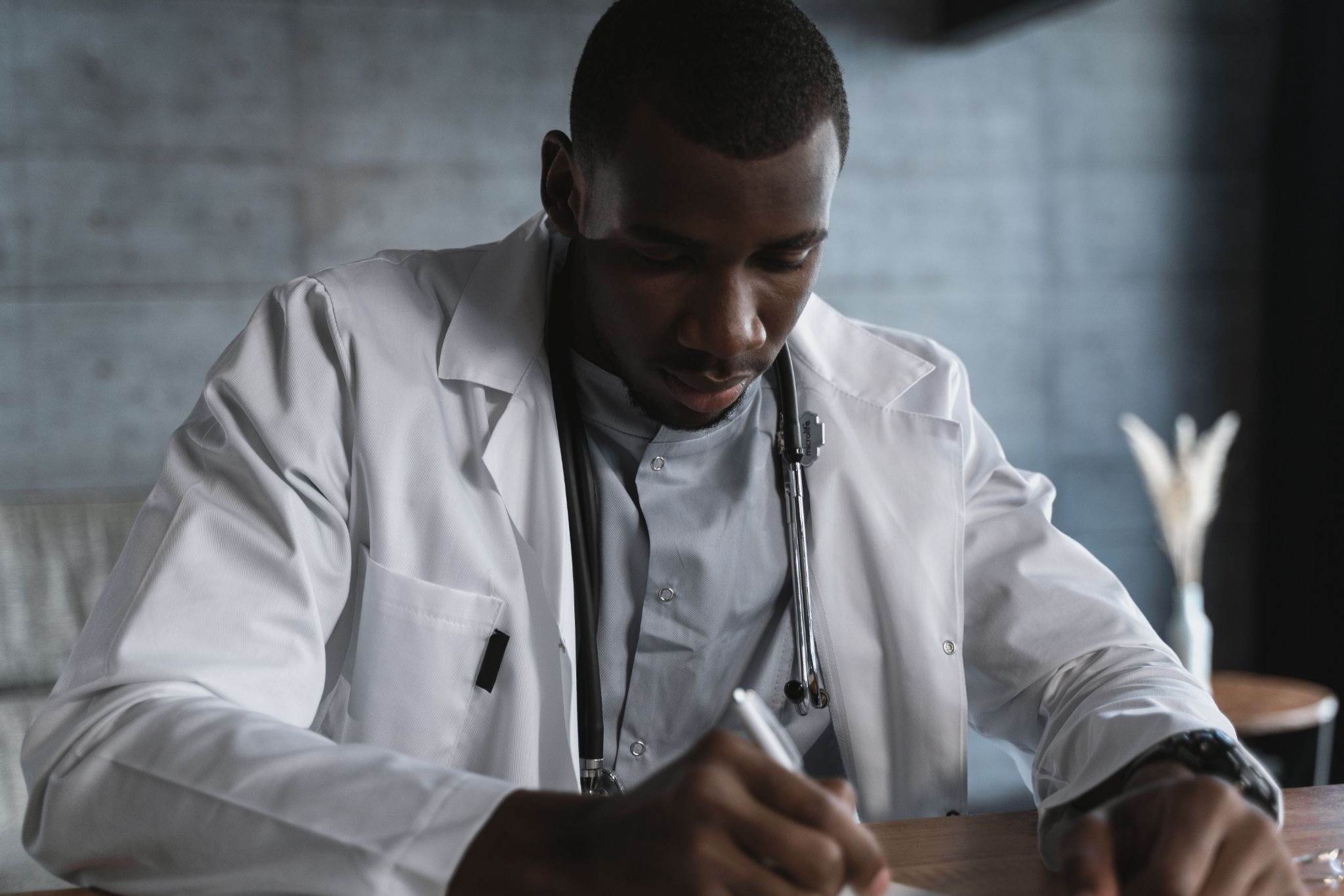 A doctor discussing with his wife the benefits between a will and a living trust