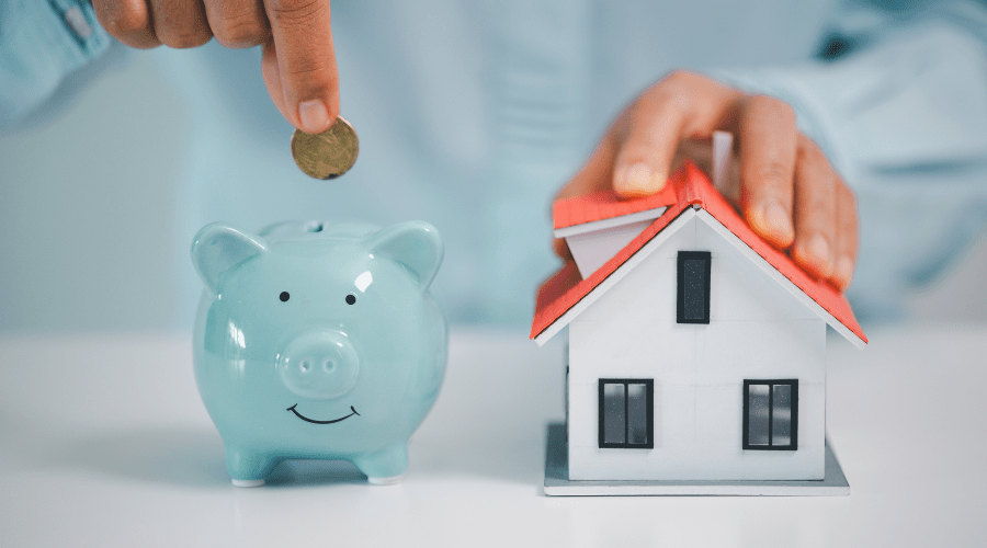 Image of a Piggy bank and house. 