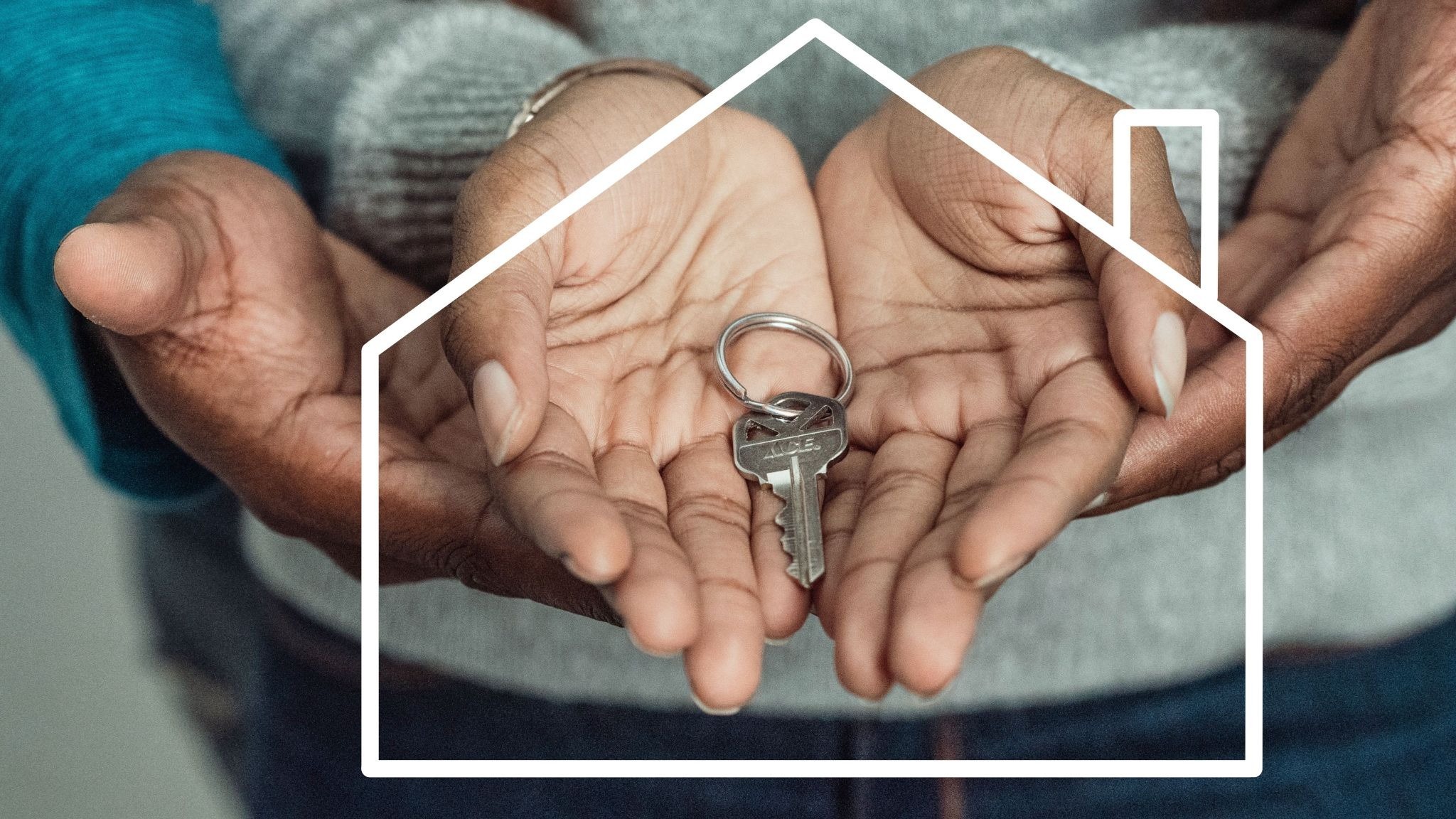 Two people's cupped hands holding a house key inside a white house outline, representing a home held in a living trust.