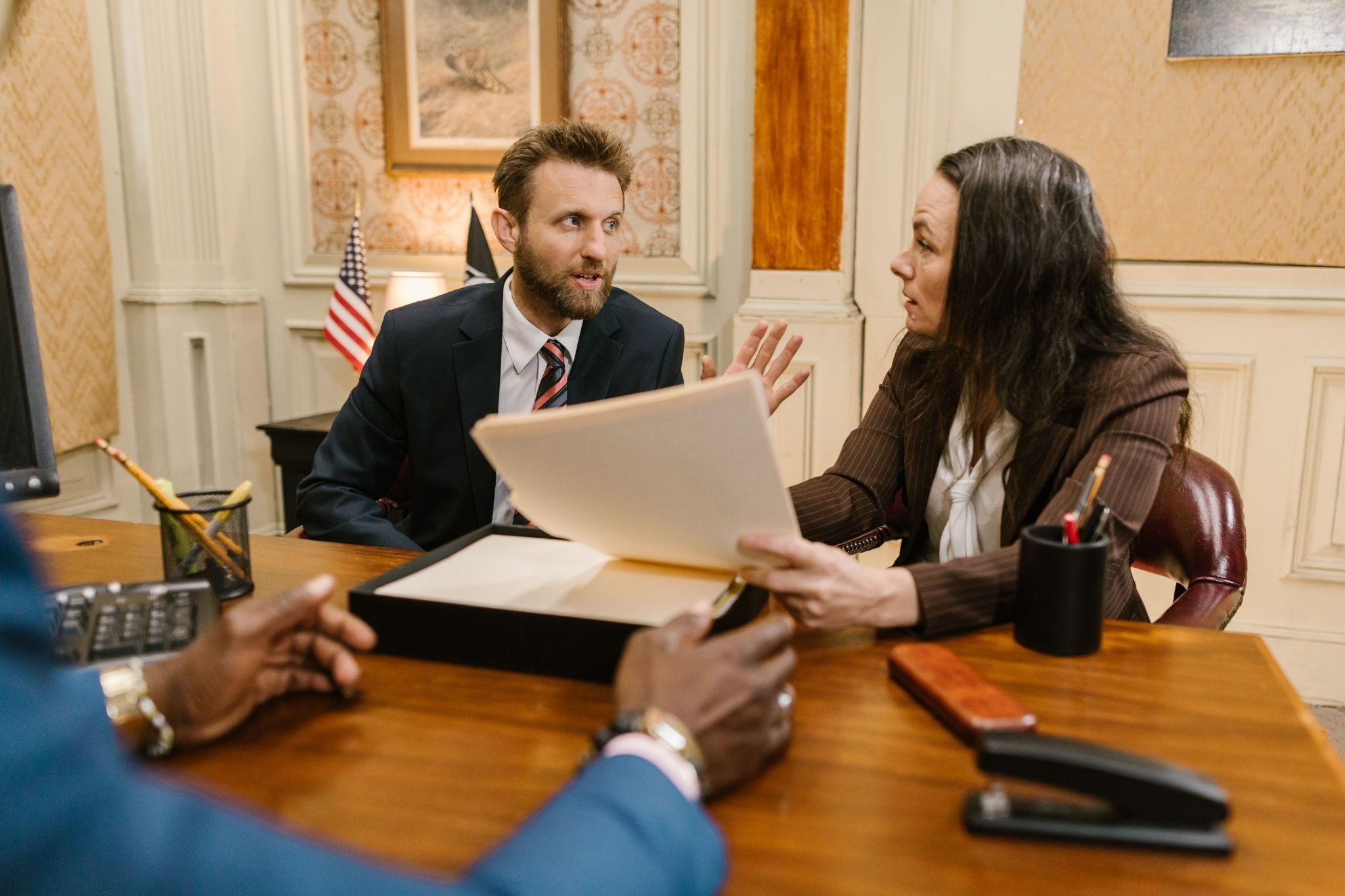 A man and a woman reviewing their will or living trust to ensure everything is in order