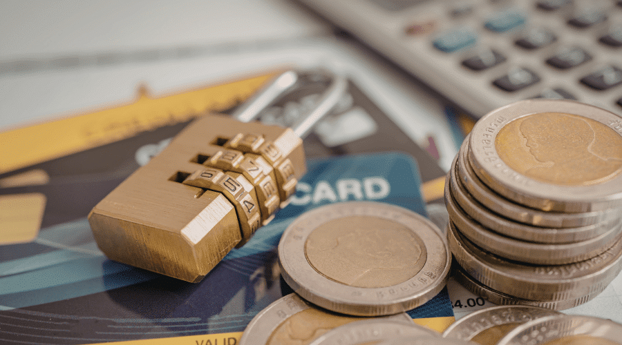 Credit Cards, Coins, Calculator, and lock 