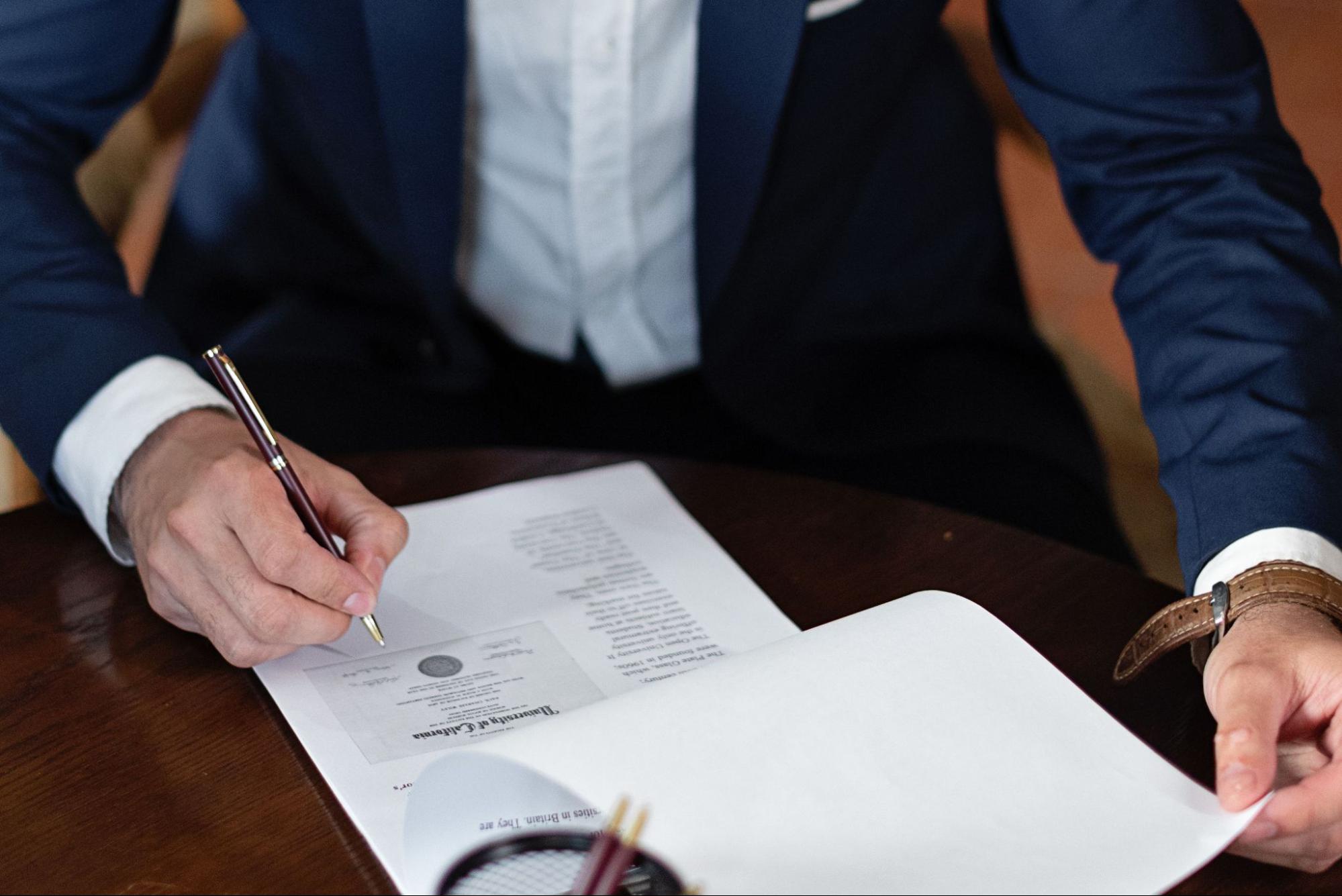 A lawyer looking over living trust documentation to ensure its correct